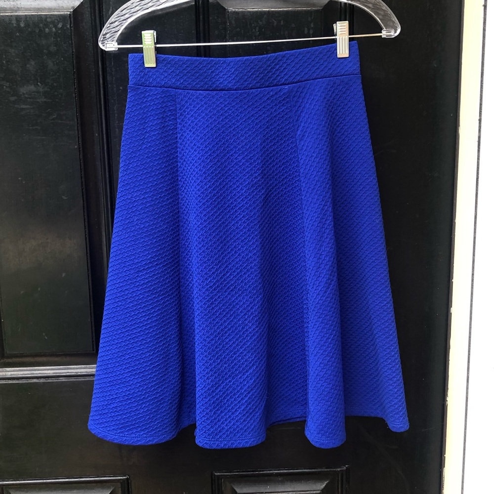 A royal blue, high waisted circle skirt